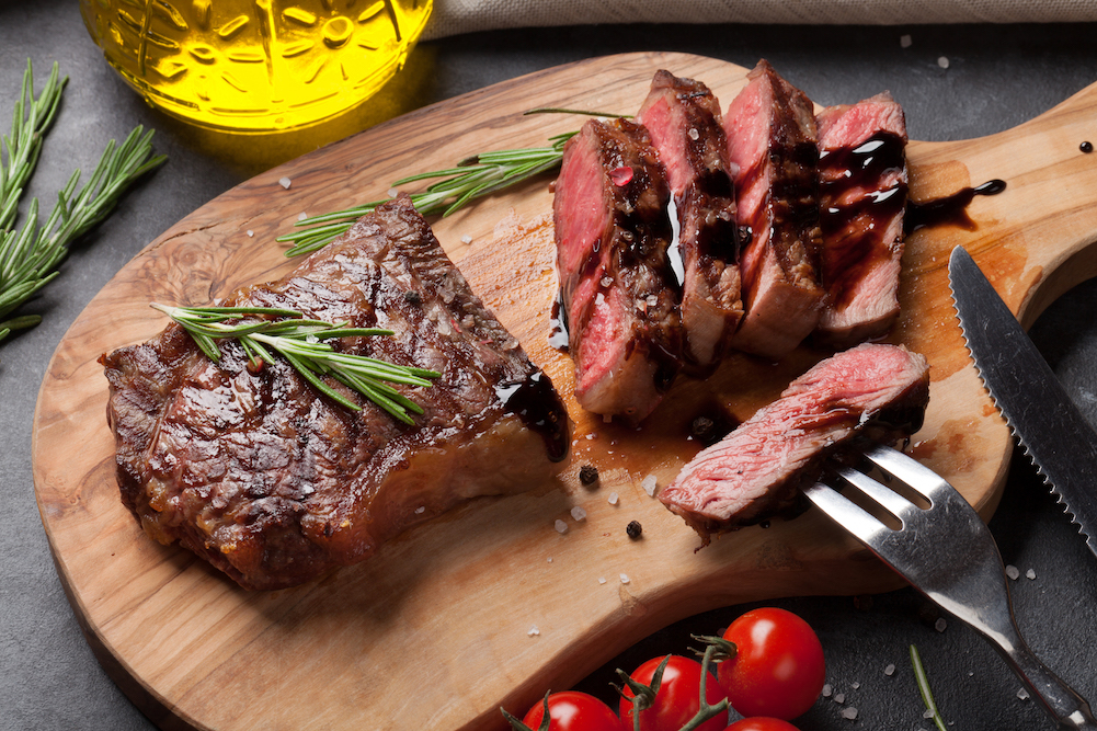 center cut steak sliced on a cutting board